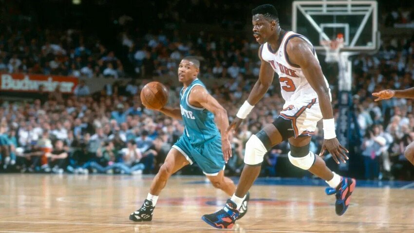5'3 Muggsy Bogues looks to pass the ball past 7'1 Patrick Ewing during a 1993 playoff game between the Charlotte Hornets and the New York Knicks.