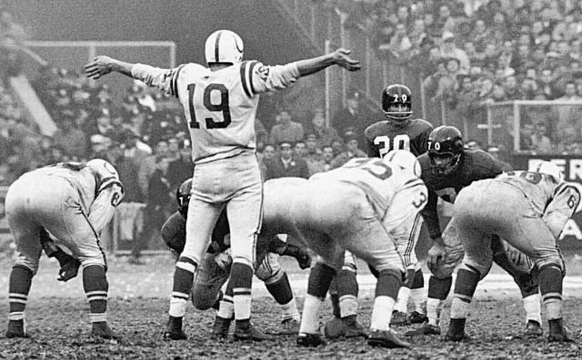 Quarterback Johnny Unitas of the Baltimore Colts calling a play at the 1958 NFL championship, the team's first national title.