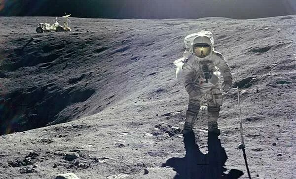 Alan Shepard, Commander of Apollo 14, practicing a golf swing on the moon (February 6, 1971). With one arm, he took 4 swings against 2 balls. The first ball traveled 24 yards and the second 40 yards.
