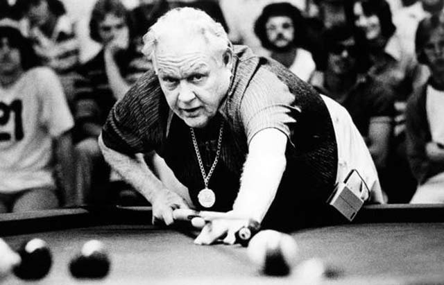 Minnesota Fats cuing for a shot.  An irrepressible showman, he was pocket billiards' greatest hustler.