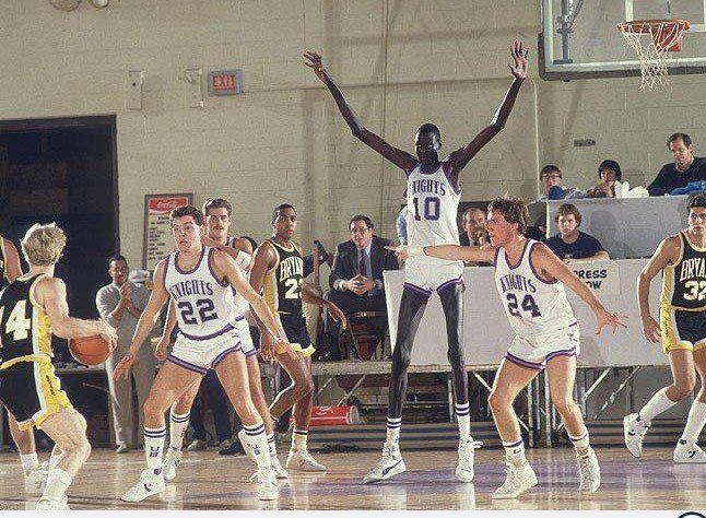 7-foot, 7-inch Manute Bol playing for the University of Bridgeport in 1984-85.  The following year, he would be the tallest player to be drafted into the NBA.
