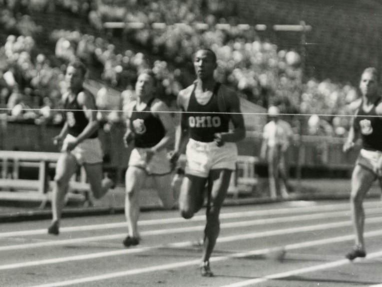 Jesse Owens moments before clearing the finish line for Ohio State University.  A year before his triumph at the 1936 Olympics, the college sophomore achieved the "greatest 45 minutes in sports".