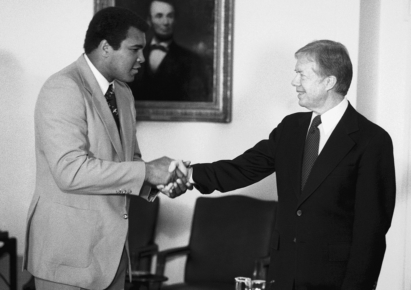 Muhammad Ali shaking hands with President Jimmy Carter at the White House on February 11, 1980. The boxing champ had just returned from a disastrous diplomatic mission in Africa to rally support for Carter's boycott of the Olympics. Within a year, both men would face the end of their respective careers.