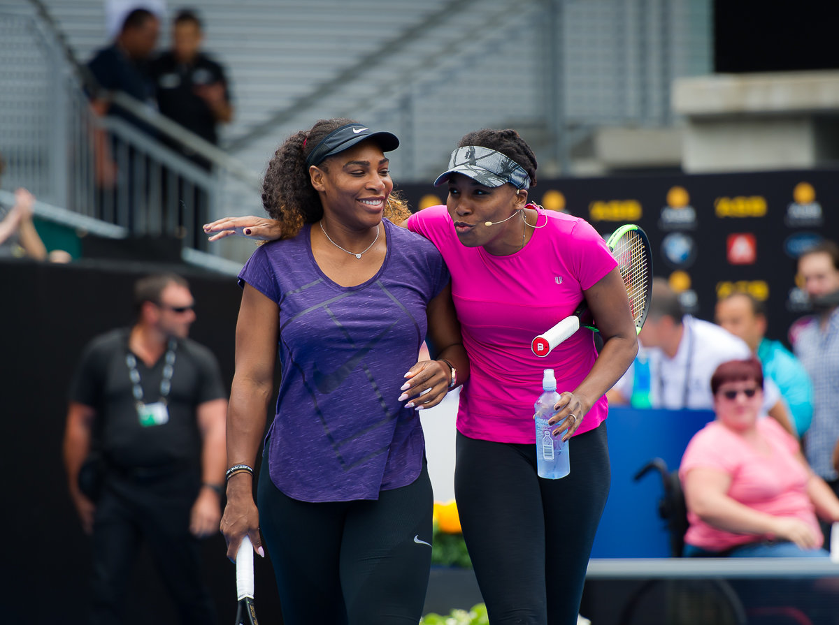 Venus (right) and Serena Williams, the most successful sibling act in sports history. Cecil Harris is author of a new book, "Different Strokes: Serena, Venus, and the Unfinished Black Tennis Revolution". The book is available for sale on our website.