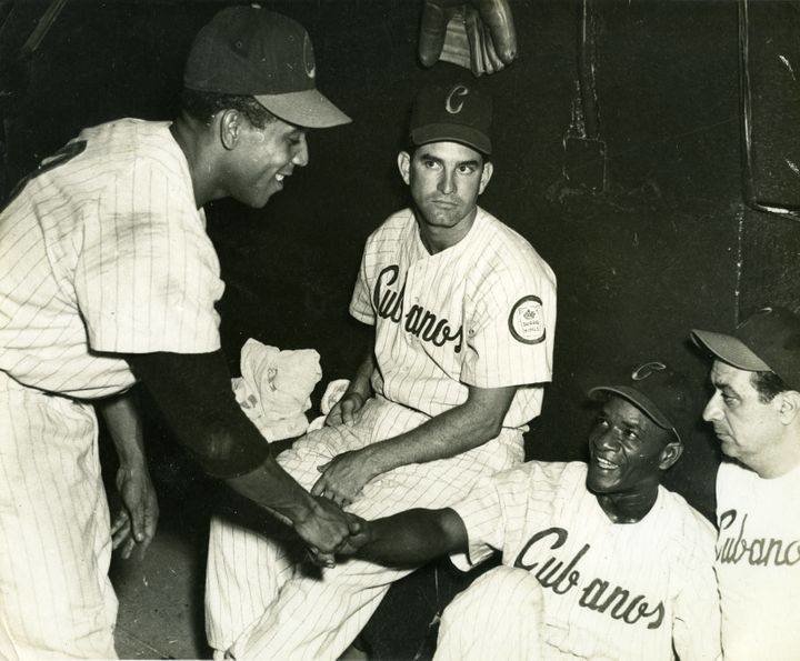 Members of the Havana Sugar Kings in the dugout during one of their games. In far right is Reggie Otero, who managed the club from 1954-57.