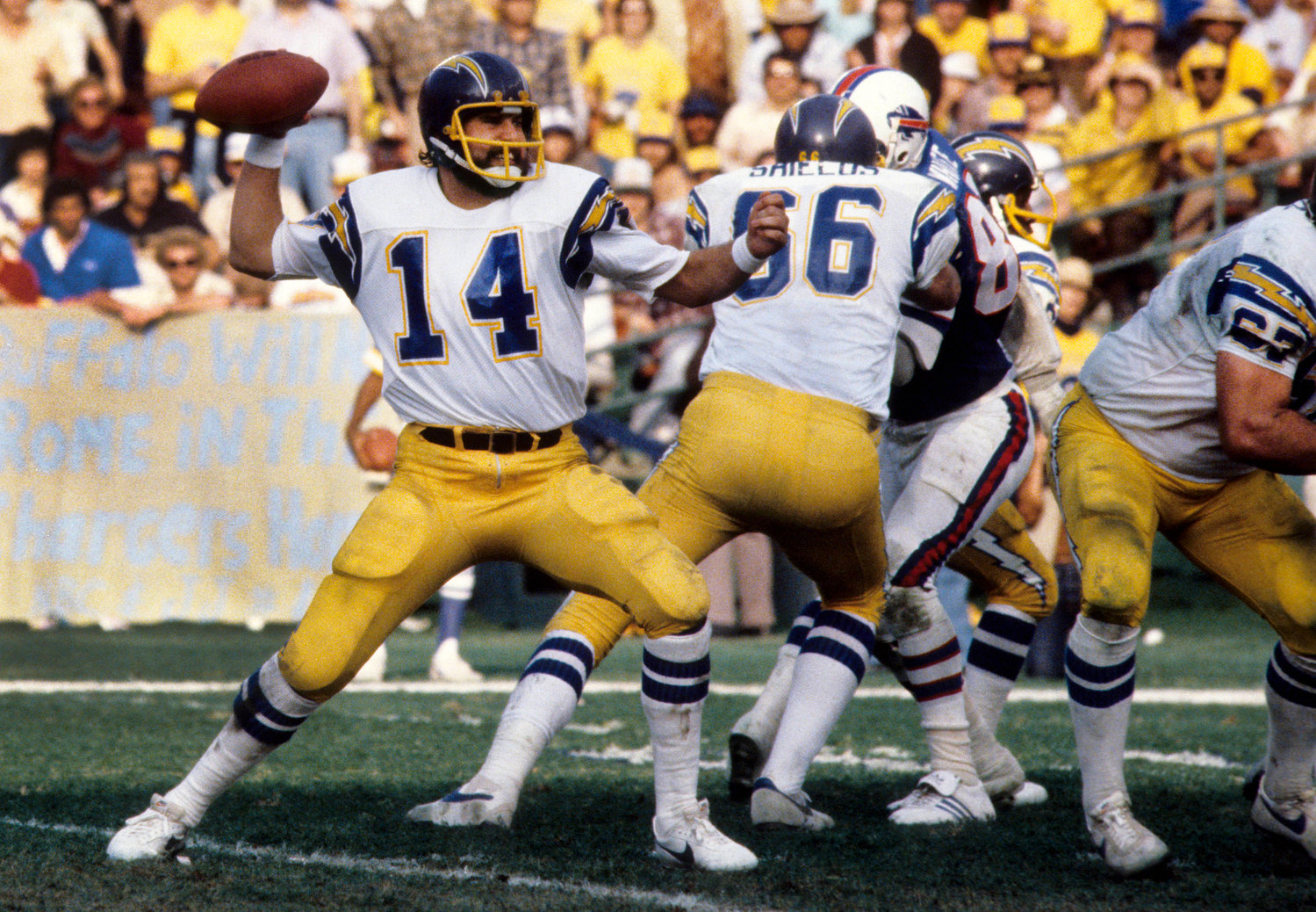 Dan Fouts launching against the Buffalo Bills during the 1980 AFC Divisional Playoff Game. Fouts spent 15 years with the San Diego Chargers, followed by 30 years in broadcasting.