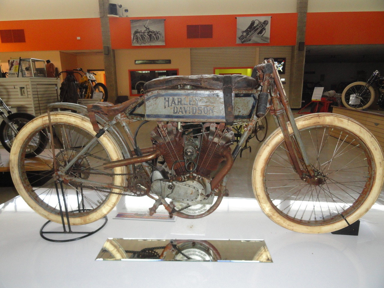 A 1915 Harley-Davidson Dodge City racer shown at the Motorcyclepedia Museum in Newburgh, NY. Note the leather pad wrapped on the fuel tank that allowed rider to lay down his chest and minimize wind resistance during the race.