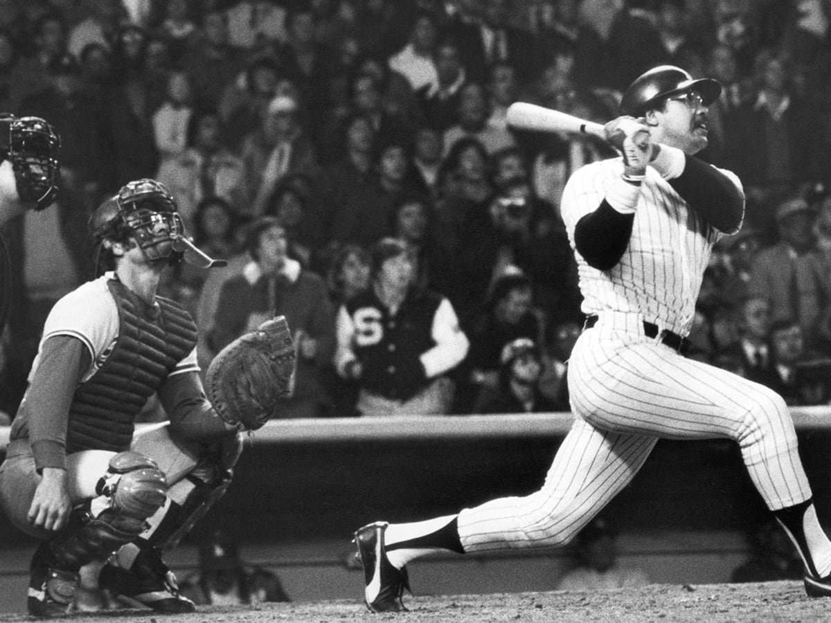 Reggie Jackson, nicknamed 'Mr. October', driving one of his 3 home runs in Game 6 of the 1977 World Series, helping the Yankees defeat the LA Dodgers 4-2.