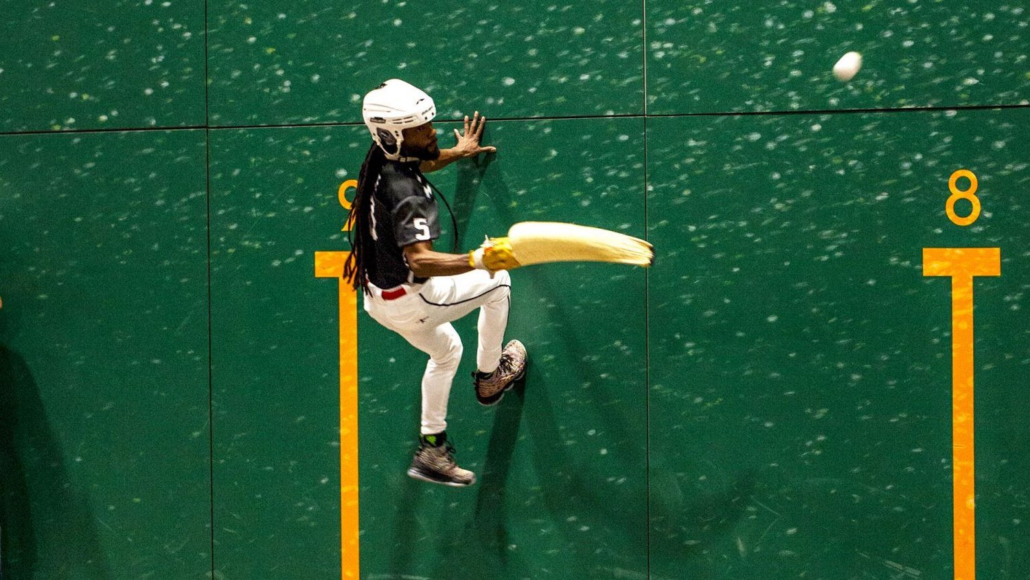 A jai-alai player scales the wall at Miami's Magic City, the last professional fronton left in the U.S. The sport is getting a business model makeover for a new generation of fans.