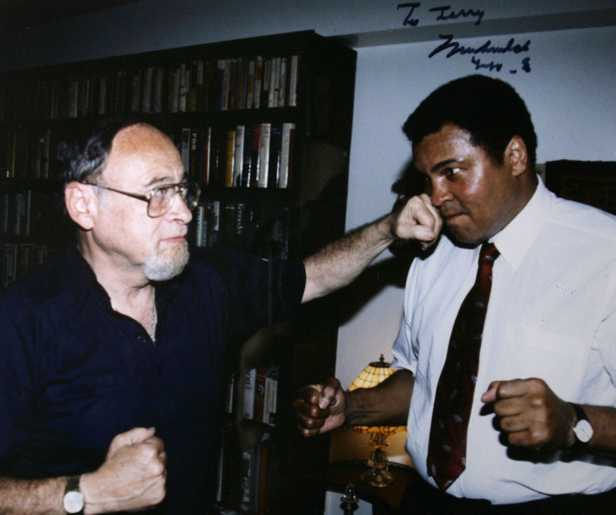 Sports journalist Jerry Izenberg joking with Muhammad Ali with whom he had a special relationship that went beyond that of a reporter and a pro athlete.