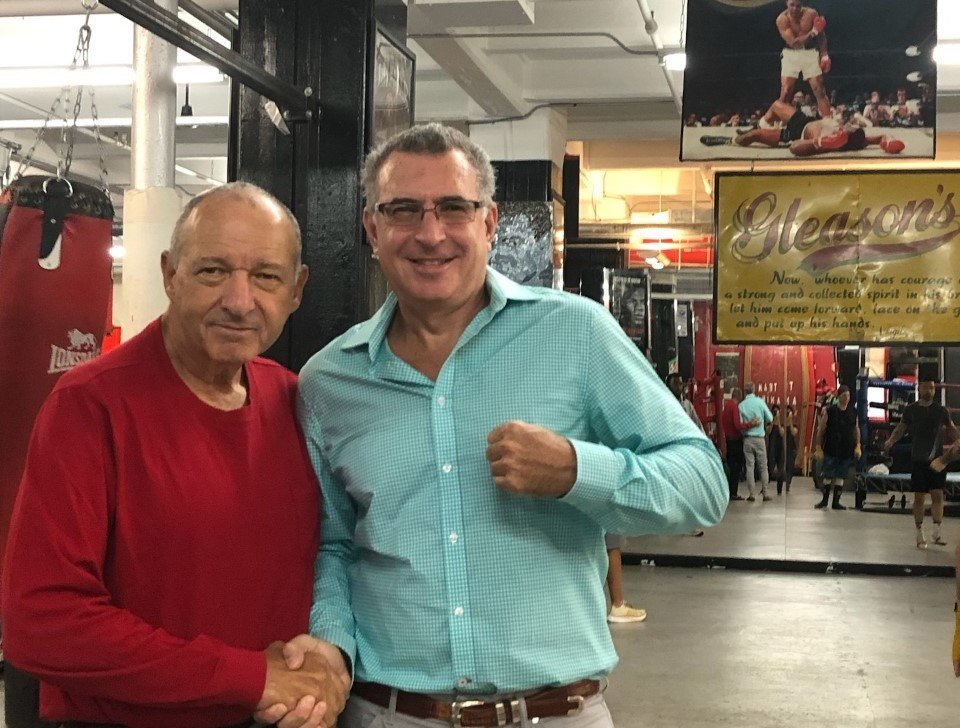 Sports History Weekly publisher, Gill Schor (right), shown with Bruce Silverglade, owner of Gleason's, the oldest boxing gym in America.