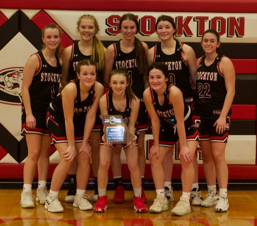The Stockton Lady Tigers pose with their second-place district trophy on Saturday, Feb. 27, after facing the highly-ranked Skyline Lady Tigers.