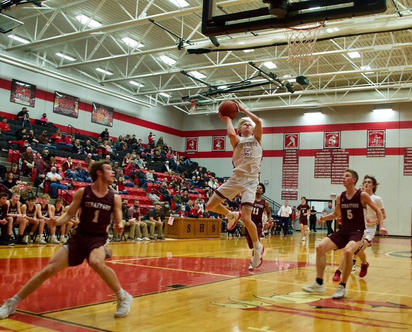 Stockton senior Tate Wheeler goes in for a layup against the Strafford Indians at home on Friday, Feb. 5, after making a speedy defensive steal.