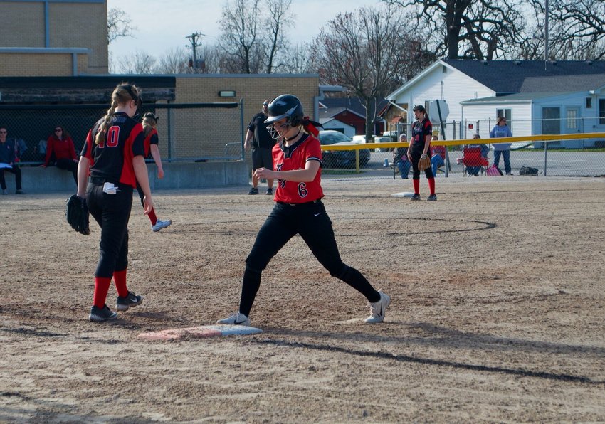 Stockton junior Abby Flora keeps tabs on first base during the Lady Tigers&rsquo; game against Lockwood on Friday, March 26.