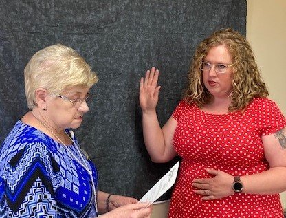 From left, CCMH Executive Assistant to the CEO, Diana Pyle, swears in Katie McGee to the CCMH Board of Trustees.