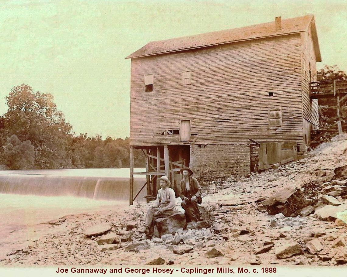 The two men pictured owned the mill in 1888. This was an earlier version of the mill before it was added onto. The dam was made of wooden planks until a few years later, when they formed concrete over the top of them. Another version of the mill was burned by Shelby's Raiders during the Civil War. There were likely 4 or 5 mills on that site.