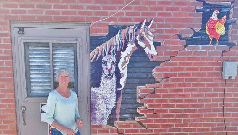 Cheryl Morris painted the playful mural on the City of Monte Vista’s water building on Highway 285 near the new O’Reilly’s Auto Parts building in Monte Vista.