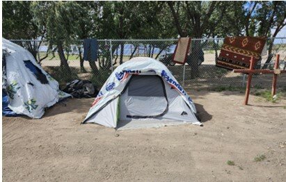 As the city considers new rules at St. Benedict homeless encampment, the photograph, provided by the city, is a visual representation of what a ‘clean campsite’ looks like. It also includes a tent, which is the only structure to be allowed under the proposed rules.  