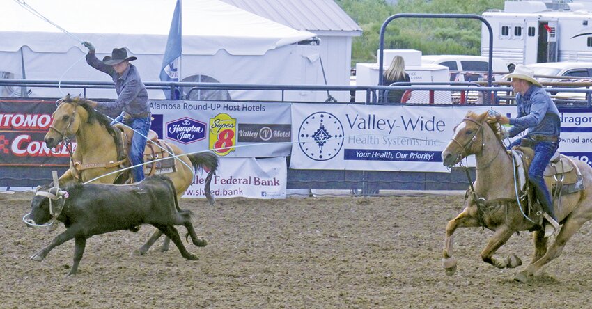 Saguache’s Klayt Staudt (left) competes is team roping with his brother, Jace, in last month’s Alamosa Round-UP.