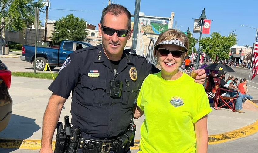 New Monte Vista Police Department Chief Sean McDonagh, left, takes a photo with MV City Manager Gigi Dennis, right, during the Stampede Parade. McDonagh was recently hired to be the new chief in Monte Vista.