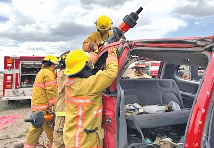 Students in the Explorer Program are learning how to use the tools necessary to cut the roof from a car, all part of their extrication training they received in the program started by the Alamosa Fire Department this year. Eight students were selected, and all completed the program.