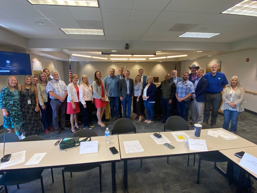 US Senator Michael Bennet (center) met with Valley civic and community leaders to discuss electric transmission lines.