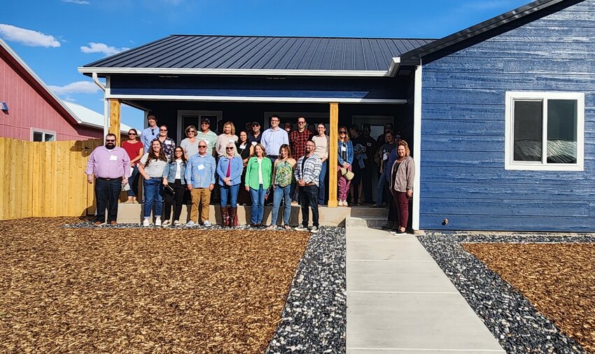 Flowers and a photo await the new owners of a house recently completed and purchased through the program. 