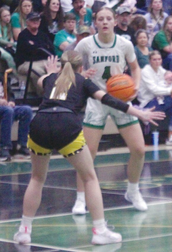 Sanford High School’s Claire Crowther (4) looks to put up a shot over Sargent’s Rylee Shirley (2) in Saturday’s Southern Peaks League Tournament blue bracket game at Monte Vista. The Lady Mustangs have advanced to the Class 2A semifinals.