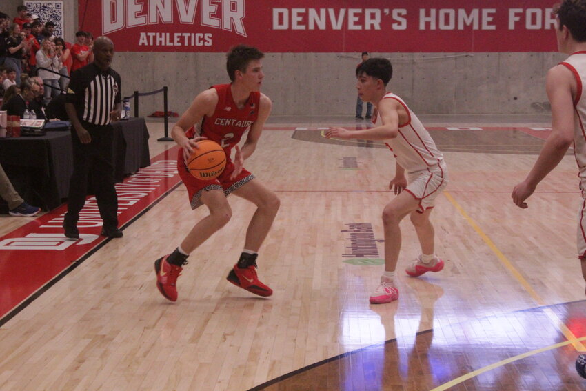 Centauri High School's Troy Sowards (2) dribbles the ball while Yuma's Brody Sheffield (3) plays defense. Sowards scored 16 points, including the game-winning 3-point basket, to give the Falcons a 41-40 win over the Outlaws.