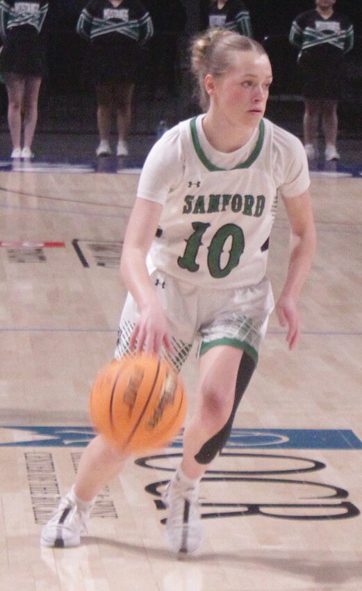 Sanford High School’s Brooklynn Reynolds makes a move to the basket in Saturday’s Class 2A State Tournament game against Akron at the Blue FCU Arena in Loveland. Reynolds scored 10 points as the Lady Mustangs defeated the Lady Rams, 43-38, to finish in third place.