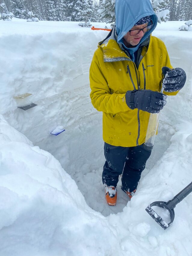 On March 14, this researcher with the Center for Snow and Avalanche Studies (CSAS) is measuring the amount of dust in a profile of snow at this research plot near Wolf Creek Pass.  