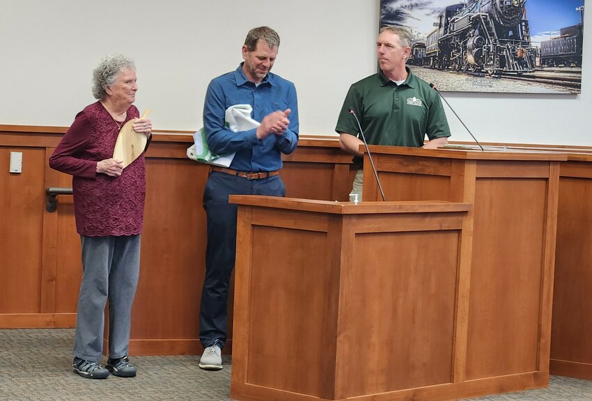 Marion Loser (left) receives the Distinguished Service Award from the Colorado Tree Coalition. Andy Rice, director of Alamosa Parks and Recreation (center) and Adam Moore (right), Colorado State Forest Service.  