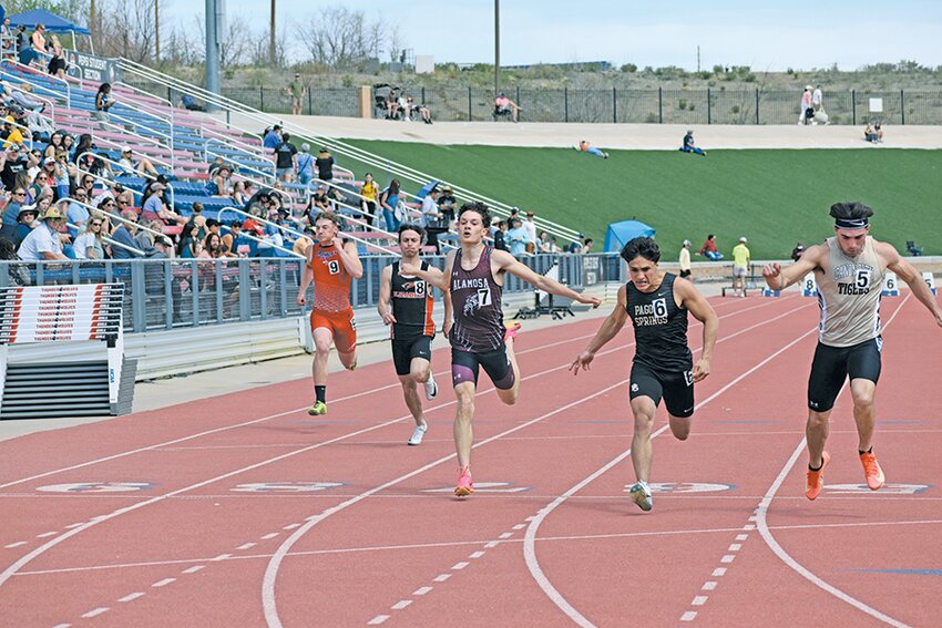 Alamosa High School’s Brayden Moeller (center) set a new school record in the 100-meter dash at the Thunderstorm Invitational last Saturday at CSU Pueblo.