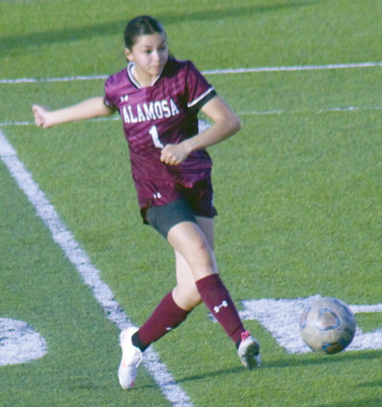 Alamosa High School’s Leah Higareda kicks the ball towards the goal in Tuesday’s 10-0 win over Del Norte at AHS stadium. Higareda recorded a natural hat trick.