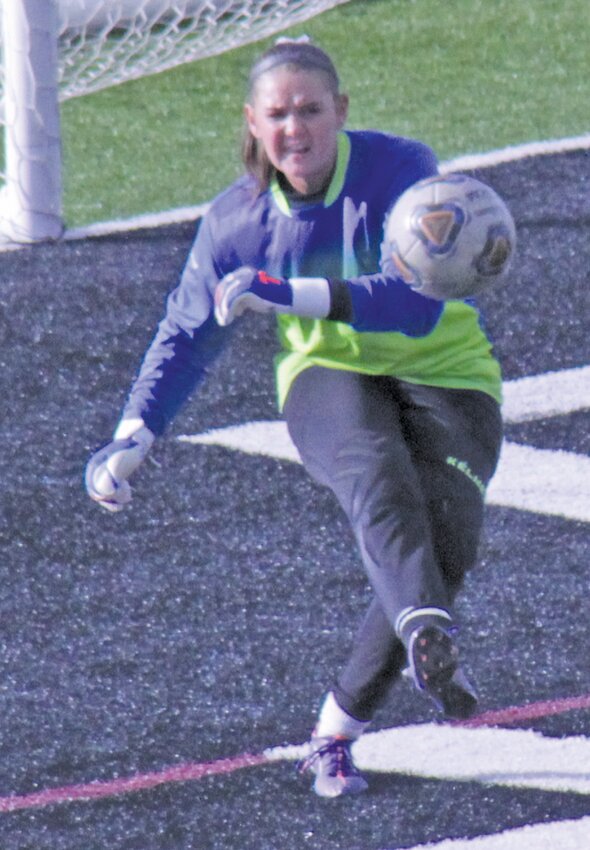 Alamosa High School goalkeeper Emily Tibbits punts the ball away in Thursday’s Class 3A State Tournament first-round game against Holy Family at AHS stadium. Tibbits had seven saves, but the Lady Mean Moose lost, 1-0, to end the season.