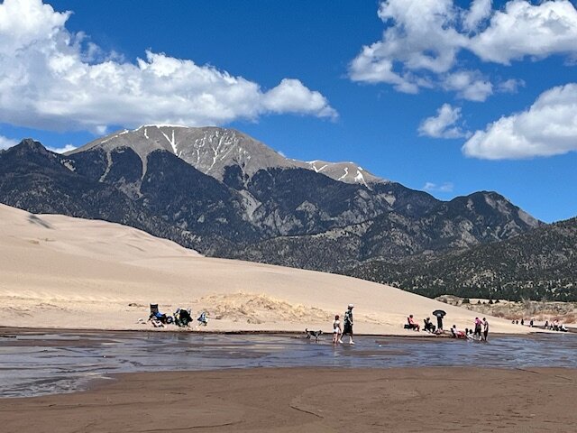 Visitors were seen in Medano Creek on May 3, enjoying the cool water in the shadow of 13,345-foot Mount Herard. The peak is named after Valley rancher Jean-Franciois Herard, who settled in the area in 1876.  