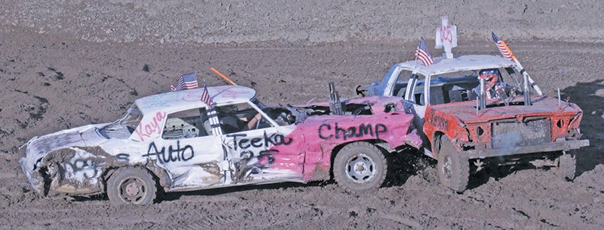 Teeka Chacon (left) smashes into Ryan Cordova in the old school class at the Alamosa Round-up demolition derby on Saturday. Chacon won this events as well as large cars, and Cordova was second.