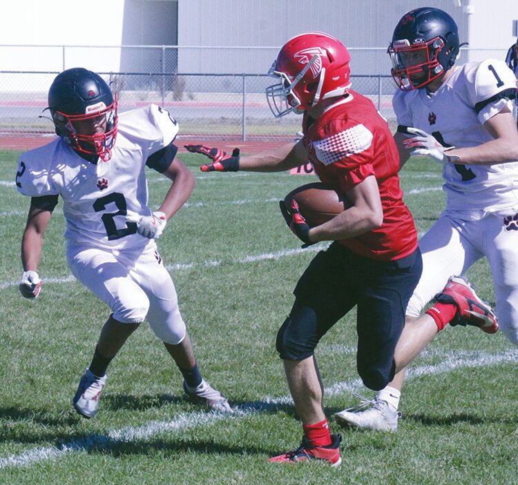 Centauri High School’s Carson Shawcroft moves past Ignacio’s William Mendoza-Lechuga (2) and Zane Pontine (1) en route to a touchdown in Saturday’s game at the Falcons’ field. The Falcons defeated the Bobcats 53-13.