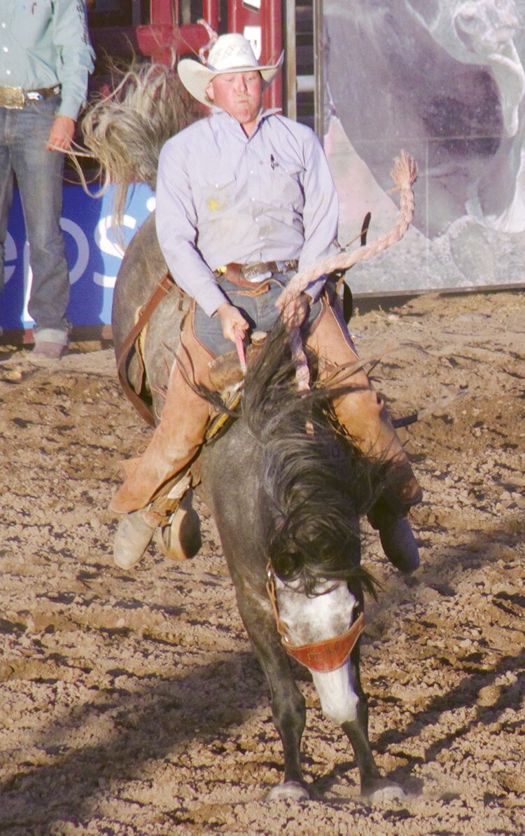 Dakota Canfield of Damnera Ranch rides John in ranch bronc riding at the Alamosa Round-up ranch rodeo Friday at the rodeo grounds. Canfield won the event with 83 points, and Damnera Ranch won the team competition for the third year in a row with 16 points.
