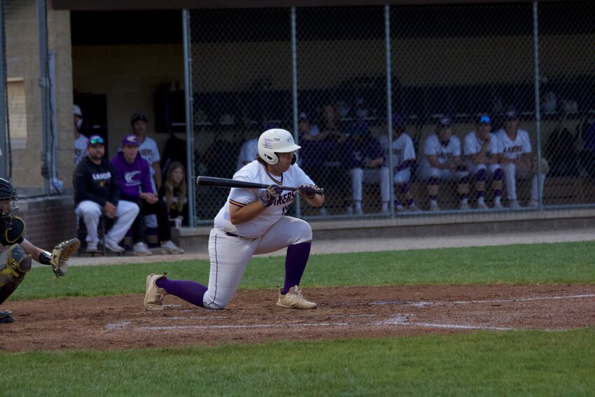 Camdenton senior first baseman Nick McNerney (No. 19) lays down a bunt during the 9-2 win over Neosho during day one of the Paul Dudley Memorial Wood Bat Tournament on Friday, April 19, at Camdenton High School.