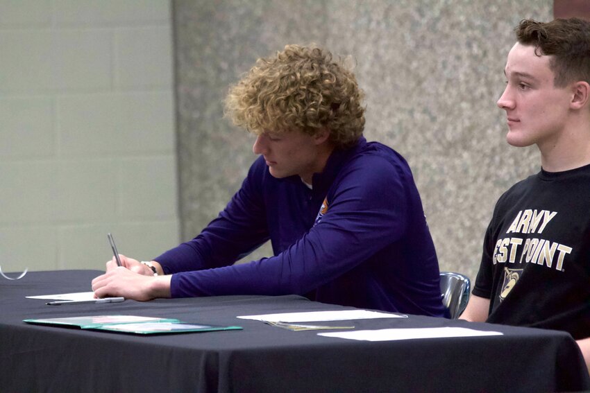 Camdenton junior Garrison Thompson (left) signed his letter to join the Mendoza United Futbol Club in Argentina on Tuesday, April 30, at Camdenton High School.