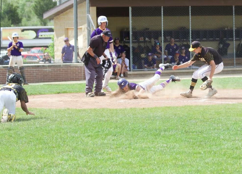 Camdenton senior pitcher Jackson Basham is called safe while sliding home on a passed ball to tie the game 1-1 in the bottom of the first inning during the 13-3 win over St. Elizabeth on Saturday, May 4, at the CHS Baseball Field.