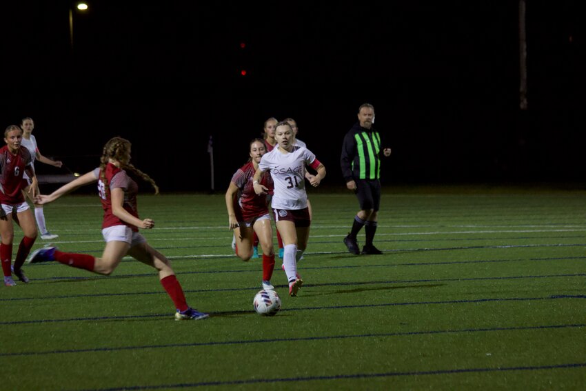Senior striker Grace Larson ( No. 31 ) scored to tie the match 1-1 for No. 5 Osage in the first half during the 2-1 loss to No. 4 St. Clair on Monday, May 13, at the Helias Catholic Athletic Complex.