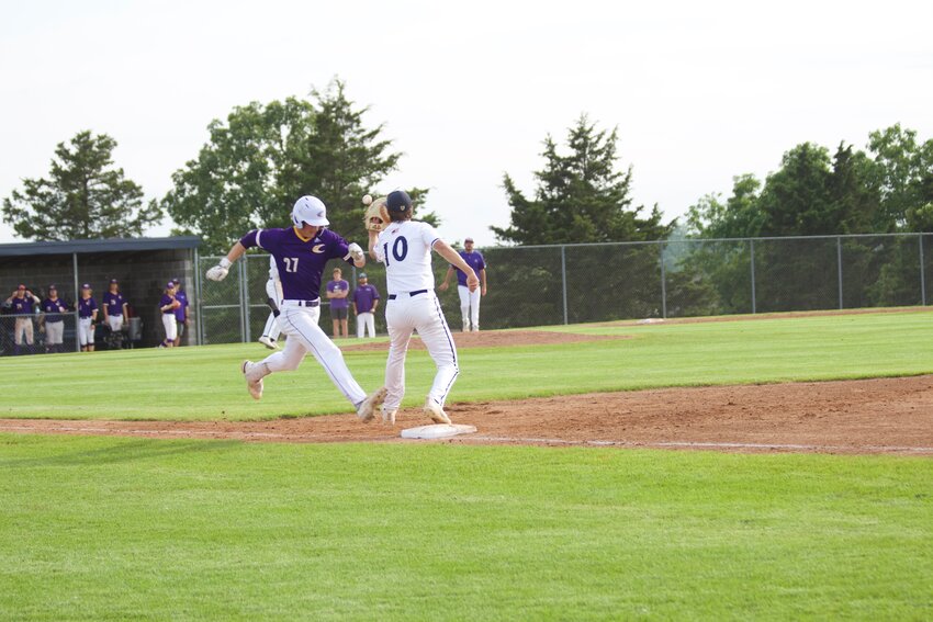 Camdenton junior shortstop Karson Durnin ( No. 27 ) beats the throw and is called safe at first base during the 3-1 loss to Helias Catholic in the Class 5, District 5 tournament on Wednesday, May 15, at the Legion Sports Complex in Jefferson City. Next season the Lakers will be joining the Crusaders in the Central Missouri Athletic Conference (CMAC).