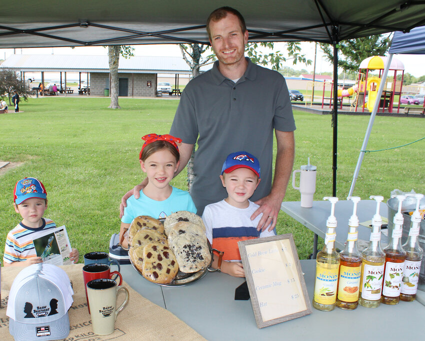Family business – From left, Isaiah, Lydia, Zach and Elijah White pause for a photo Friday afternoon, July 19, at their Eldon Farmers Market booth.