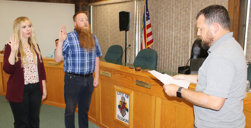 It’s official – Eldon Mayor Trevor Vernon (right) swears in Delaney Dummermuth as new deputy city collector and David McKinney as city clerk during the Tuesday, July 23 city council meeting. McKinney replaces Leslie Wilson, who resigned Thursday, July 9.