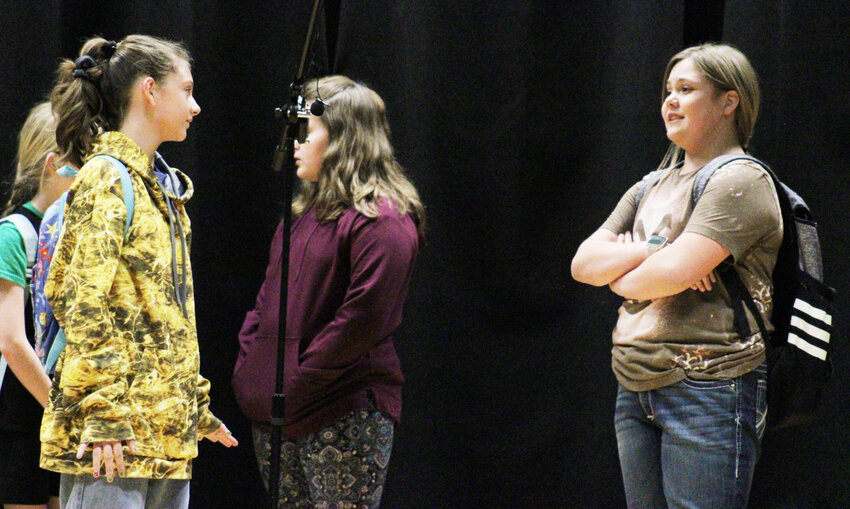 Iberia Elementary students Sally (Mackenzie Pyke) and Molly (Taitam Cartwright) visit before class in the Thursday, April 10 play "Where's Mrs. Johnson?"