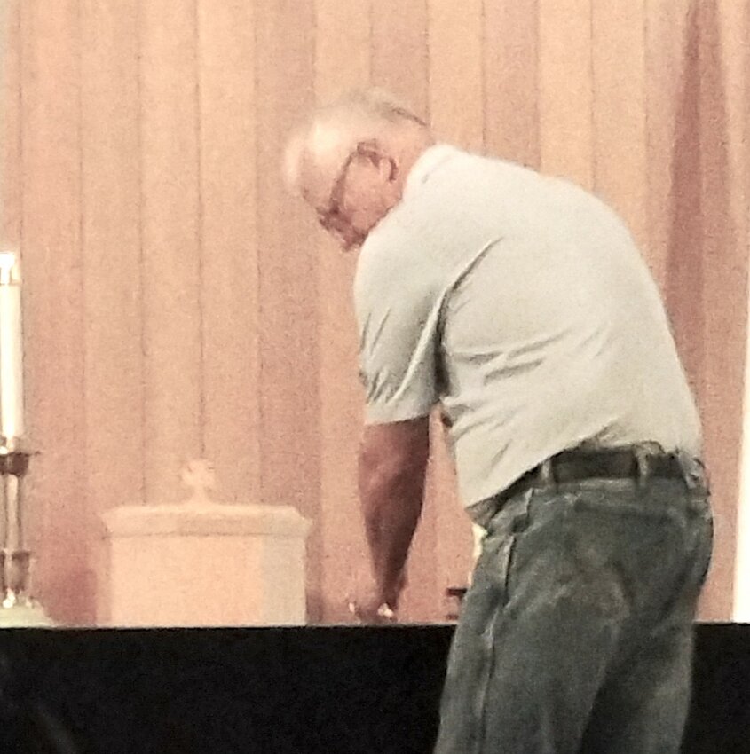 And darkness fell
Mike Kelley, pastor of the Fortuna Community Church, extinguishes a candle during the Tipton Ministerial Alliance Community Good Friday service Friday evening, April 18. About 40 attended the service hosted by Tipton United Methodist Church. The candles were used in a Tenebrae service representing the darkness that fell upon the land at the crucifixion of Jesus Christ.