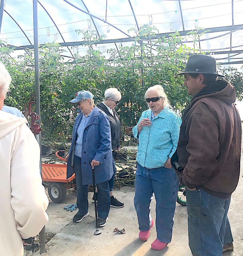 Touring greenhouse 
Grow and Glow Garden Club members Nancy Byars, Verna Koechner and Dorothy Collett visited a hydroponic garden greenhouse in Mennonite Country with owner Samuel Leed during their April meeting.