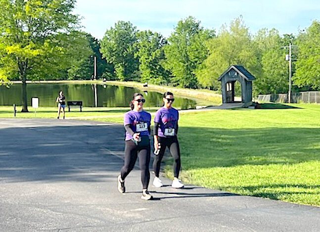 Fast walker
Addie White walks a step ahead of her mother, Melissa Broyles, to win the overall medal for walkers in the For Yo’ Mama 5K held Saturday, May 10. The event raises money for the Tipton Nutrition Center where it started and wound through the park and nearby neighborhoods.